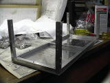 Aluminum square bars (pillars) mounted on the bottle panel