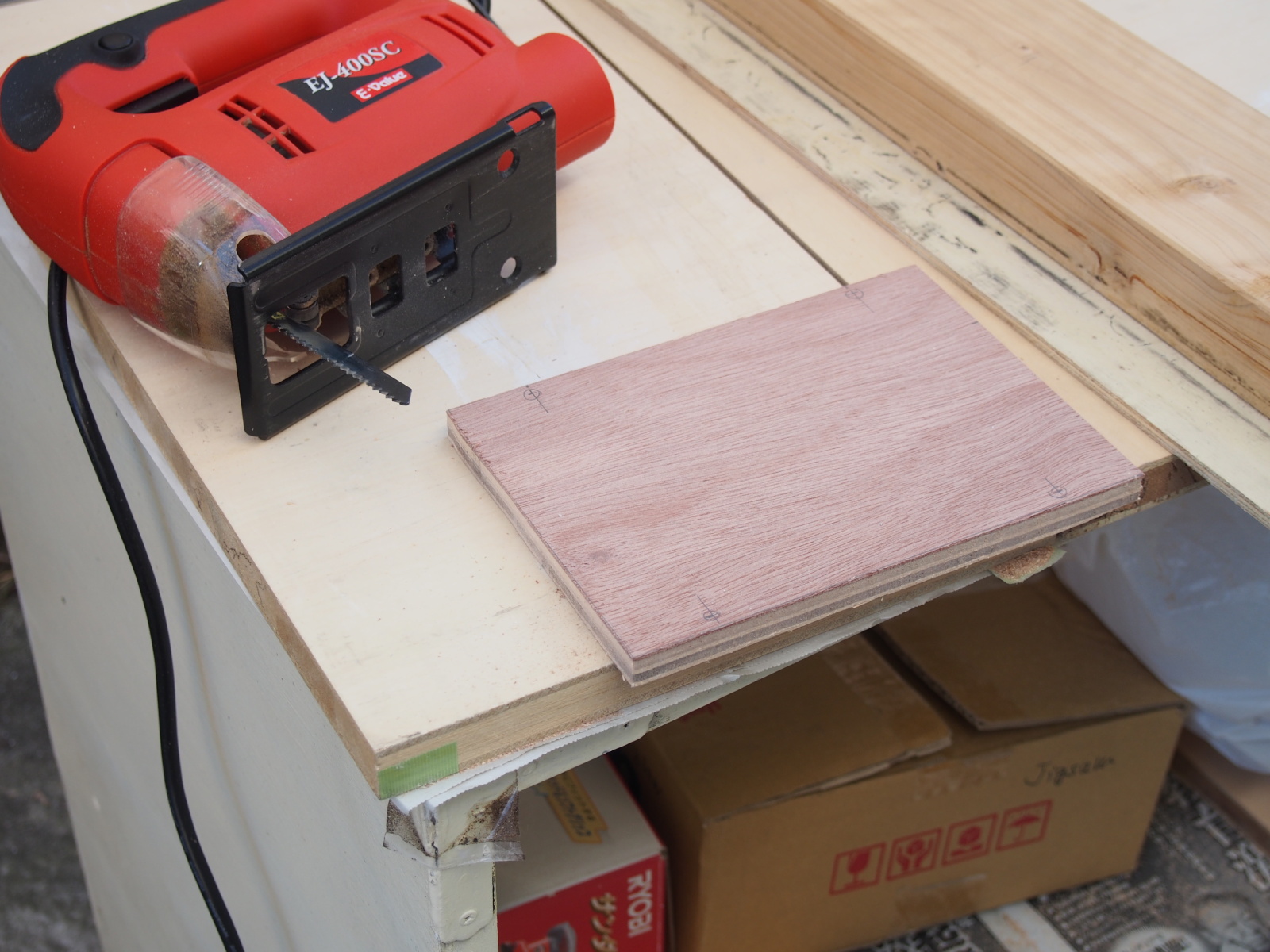 Wood Base cut out of the plywood board with the power jigsaw