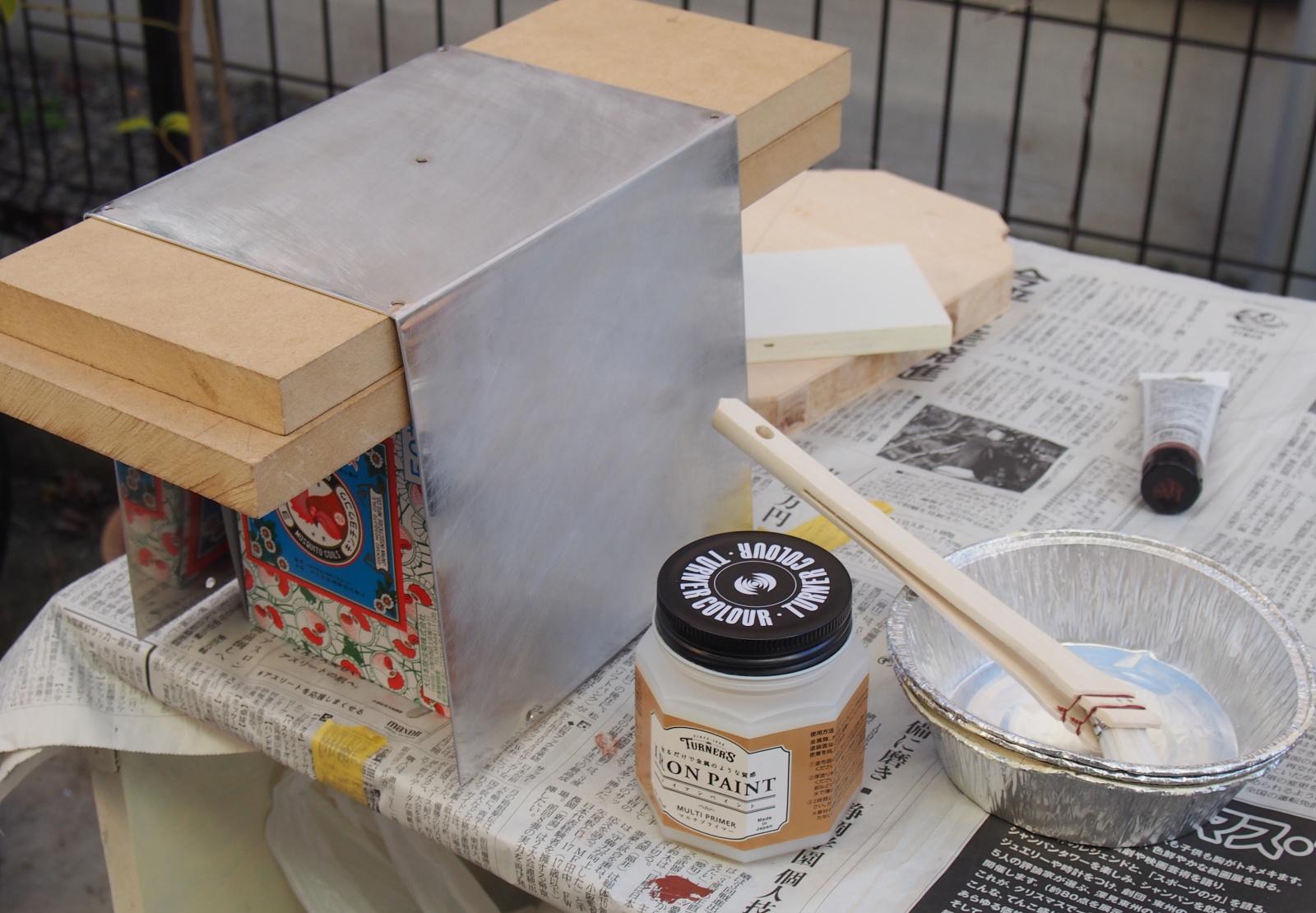 Applying primer on Top Cover